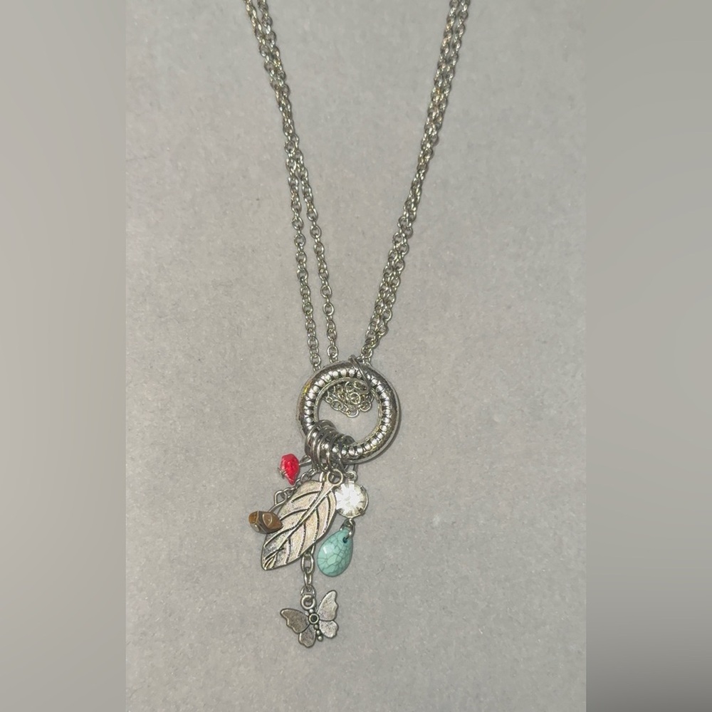 Silver Charm Necklace with Leaf and Bead Accents